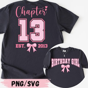 May include: Dark navy blue t-shirt with pink text and graphics. The back of the shirt says "Chapter 13" with a bow and the year "2013". The front of the shirt says "Birthday Girl" with a bow.