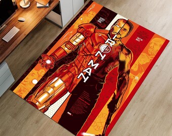May include: Rectangular area rug featuring Iron Man in a dynamic pose. The rug showcases a vibrant design with the character's armor in shades of red and gold. The words "I AM IRON MAN" are prominently displayed. The background includes orange and brown stripes.