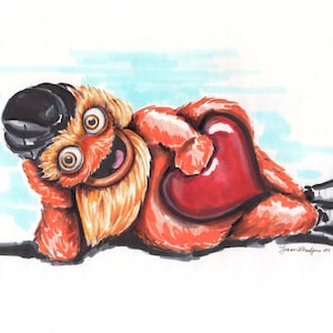 May include: A cartoon character with orange fur, a black hat, and a large red heart. The character is lying on its side with its head resting on its hand. The character has a big smile and is looking at the viewer.