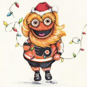 May include: A cartoon mascot wearing a red Santa hat and orange and black hockey jersey with a Christmas lights garland. The mascot has orange fur, a big smile, and a large nose.