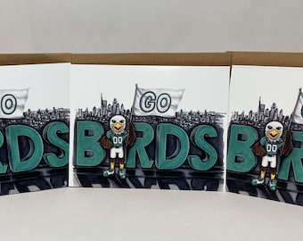 Pack of 3 greeting cards featuring an original marker illustration of swoop holding a go birds flag in front of BIRDS sign Philly skyline