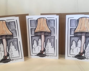 Pack of 3 5x7 Christmas greeting cards featuring an illustration of the iconic Leg lamp from A Christmas story movie holiday notecard blank