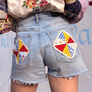 May include: A set of three ceramic nesting bowls in shades of blue, green, and white. The bowls feature a speckled glaze and a simple, modern design. The largest bowl measures approximately 6 inches in diameter.