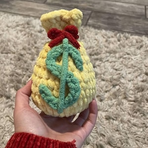 Modello di peluche a forma di sacco di soldi