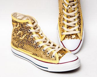 gold sparkly high top converse