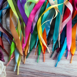 Individually handmade shoelaces made from quality single face satin ribbon at a 5/8", .375 inch, width. Over 75 different colors and lengths available: 36 inches, 48 inches, 54 inches, 63 inches, 72 inches, 96 inches.