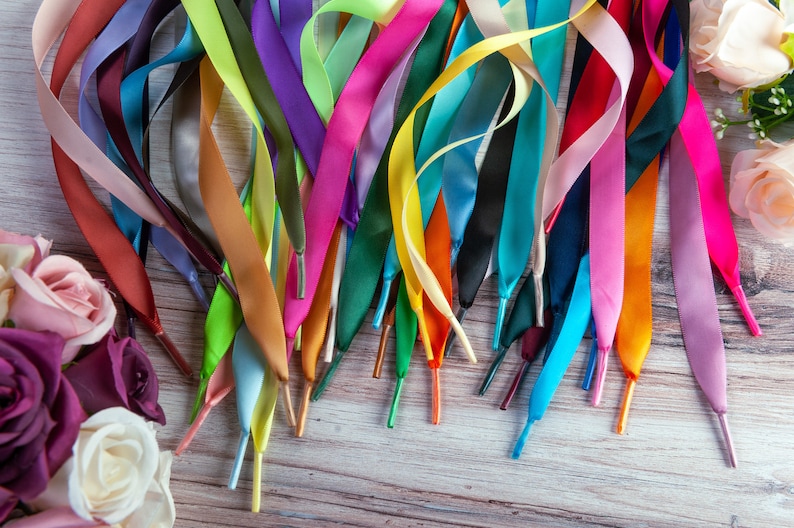 Individually handmade shoelaces made from quality single face satin ribbon at a 5/8", .375 inch, width. Over 75 different colors and lengths available: 36 inches, 48 inches, 54 inches, 63 inches, 72 inches, 96 inches.