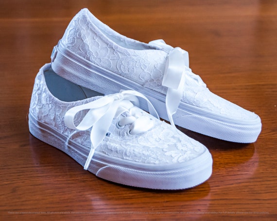 all white laced vans