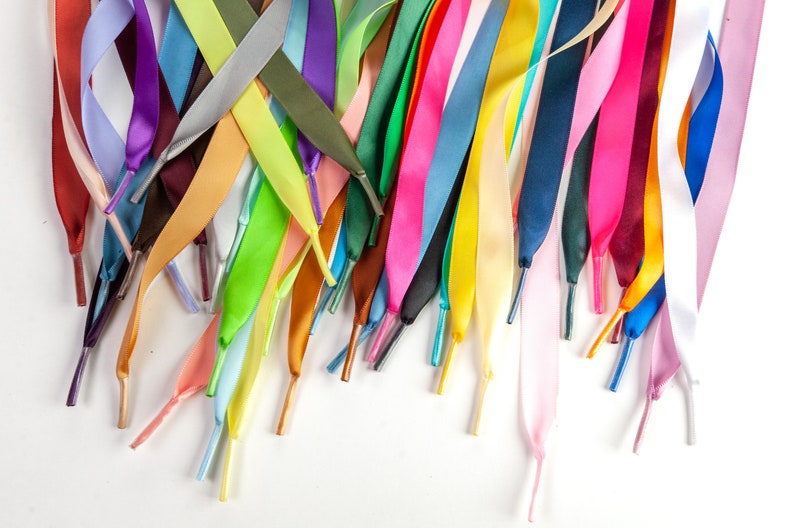 Individually handmade shoelaces made from quality single face satin ribbon at a 5/8", .375 inch, width. Over 75 different colors and lengths available: 36 inches, 48 inches, 54 inches, 63 inches, 72 inches, 96 inches.