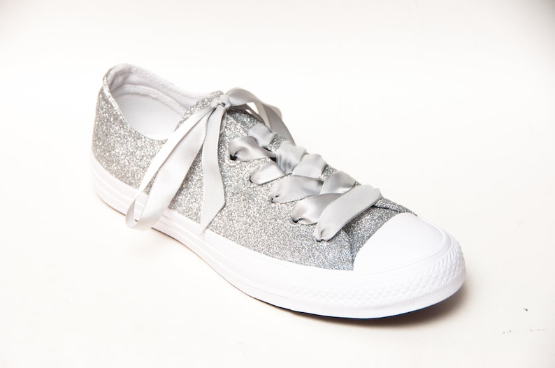 white sneakers with silver stars