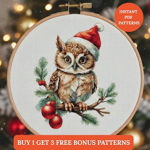 May include: A cross-stitch pattern of a brown owl wearing a Santa hat, perched on a branch with red ornaments and green foliage. The design is set in a wooden embroidery hoop. Text reads "Instant PDF Patterns" and "Buy 1 Get 3 Free Bonus Patterns."