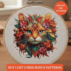 May include: A cross-stitch embroidery of a cat's face, featuring vibrant orange, red, and green colors. The cat's eyes are a striking turquoise. The design is framed in a wooden hoop. Text on the image reads "INSTANT PDF PATTERNS" and "BUY 1 GET 3 FREE BONUS PATTERNS."
