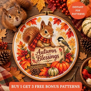 May include: A circular cross-stitch embroidery piece featuring a squirrel wearing a plaid scarf, a small bird, and a sign with the text Autumn Blessings. The design is surrounded by colourful autumn leaves, berries, pinecones, and a pumpkin.