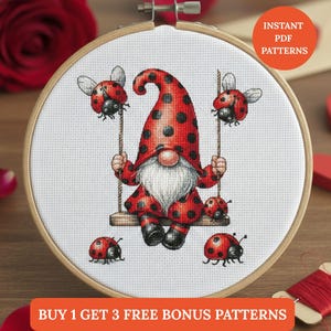 May include: Cross-stitch embroidery in a wooden hoop features a gnome in a red suit with black polka dots, swinging on a swing with ladybirds. The design includes ladybirds and the text "INSTANT PDF PATTERNS".