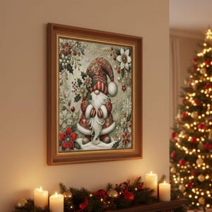 May include: A framed Christmas artwork depicting a gnome with a long white beard, dressed in a red and white patterned hat and coat. The artwork is surrounded by festive floral and snowflake designs, within a wooden frame. The image is displayed above a decorated mantelpiece.