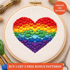 Peut inclure: Un motif de point de croix en forme de cœur dans un cercle à broder en bois. Le cœur est composé de petits cœurs colorés disposés en dégradé arc-en-ciel. Le texte sur l'image indique "INSTANT PDF PATTERNS" et "BUY 1 GET 3 FREE BONUS PATTERNS".