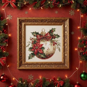 May include: A framed Christmas ornament cross-stitch design with a gold ornate frame. The ornament is white with red and green accents, including a poinsettia, holly, and a red bow. The background is red with Christmas decorations.