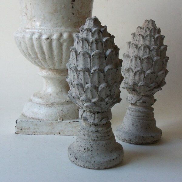 two cement finials