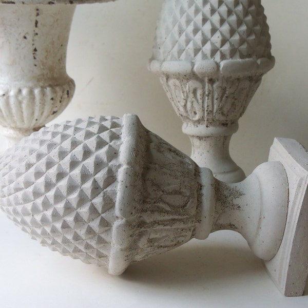 two cement finials