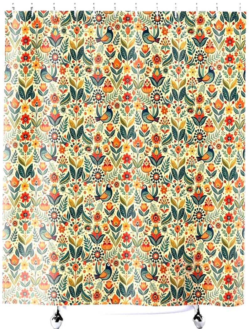 May include: A shower curtain with a repeating pattern of stylized birds, flowers, and leaves in shades of orange, green, and blue on a cream background. The design has a folk art aesthetic.
