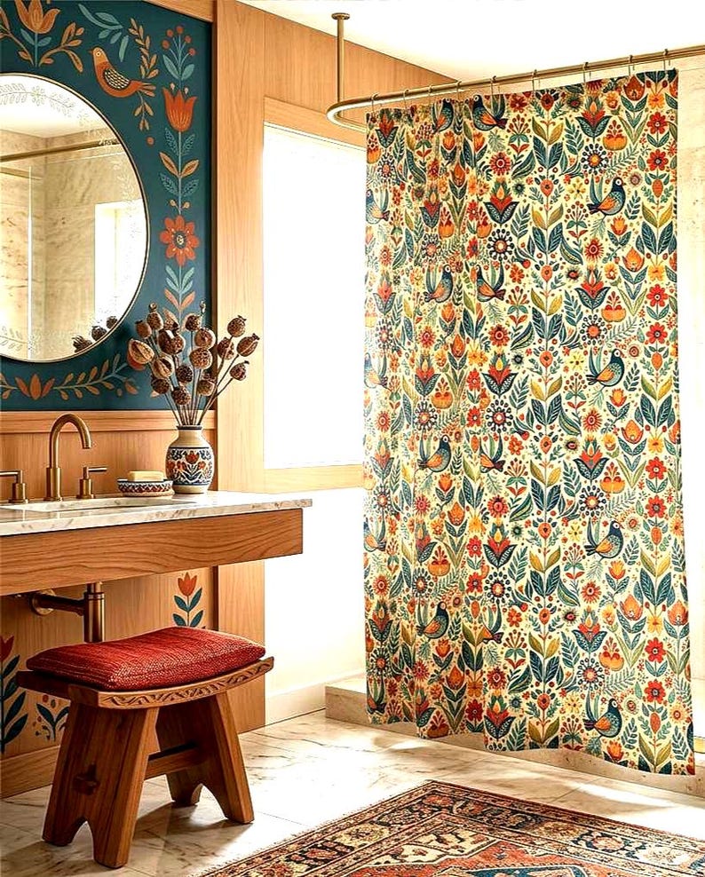 May include: A bathroom with a decorative theme. The focal point is a floral patterned shower curtain with birds, flowers, and leaves in orange, blue, and green. A wooden vanity, mirror, and stool complement the design. A patterned rug adds to the room's aesthetic.