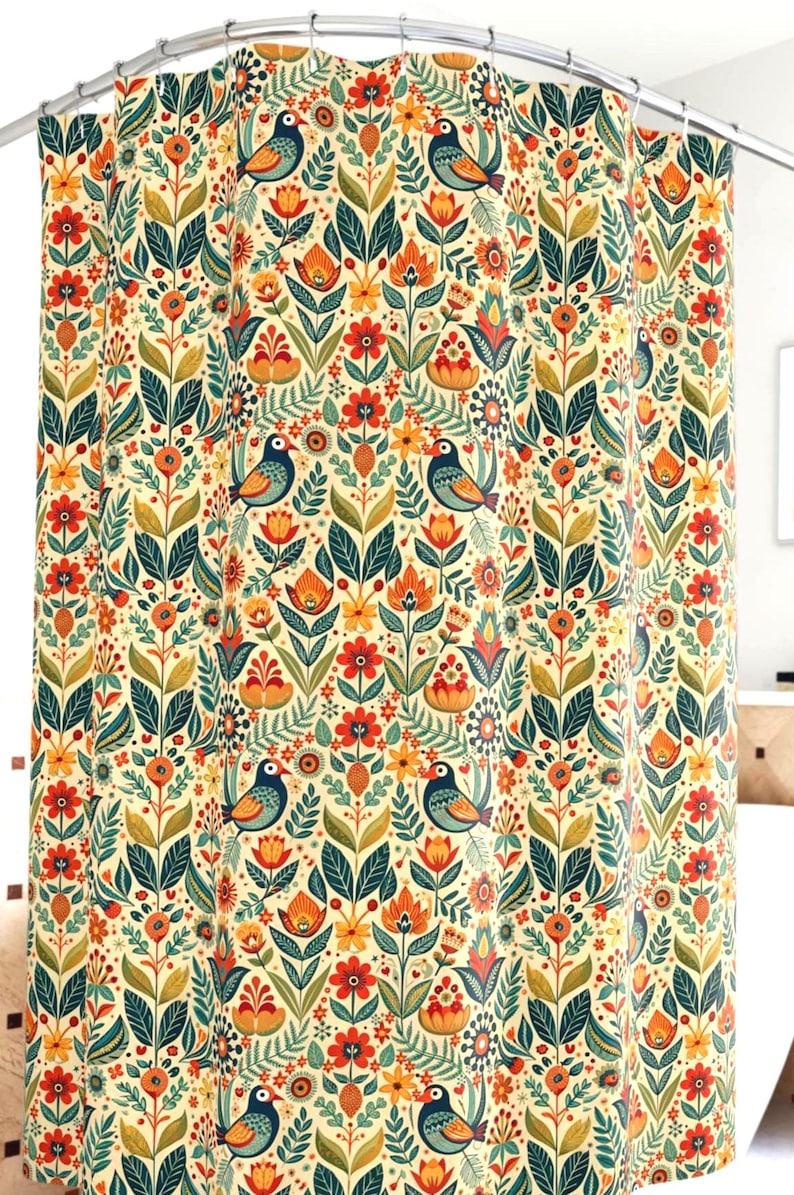 May include: A shower curtain with a repeating pattern of stylized birds, flowers, and foliage in shades of blue, orange, green, and yellow on a cream background. The design has a folk art aesthetic.