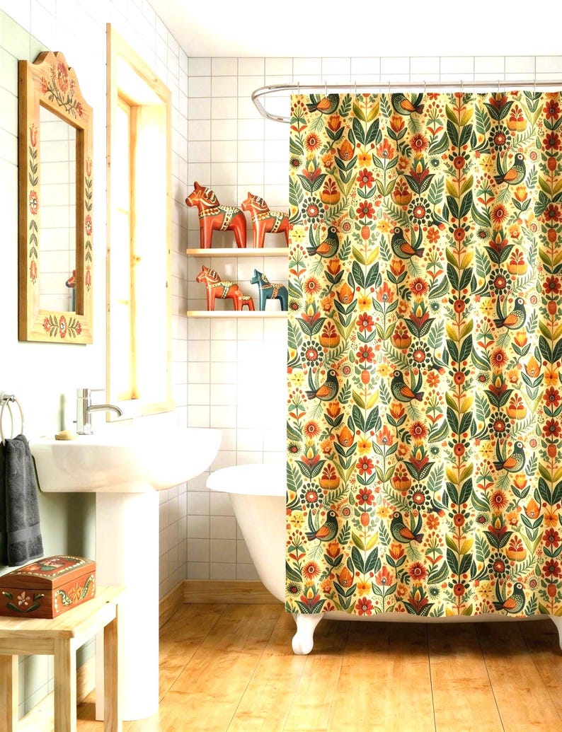 May include: A bathroom scene featuring a floral patterned shower curtain with birds and flowers in shades of orange, green, and yellow. Wooden shelves display decorative wooden horses. A wooden framed mirror and a small wooden box are also visible.