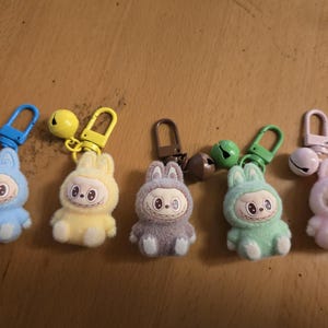 Mini 3D baby sitting labubu keychain with bell bag charm party favors