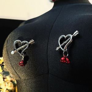 Cupid's Blade Nipple Clamps | Stainless Steel, Red Jingle Bells