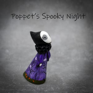 May include: A small figurine titled Poppet's Spooky Night, featuring a black hood, a white face with a single eye, a textured black collar, and a purple robe decorated with black tree silhouettes and small orange dots along the bottom hem.