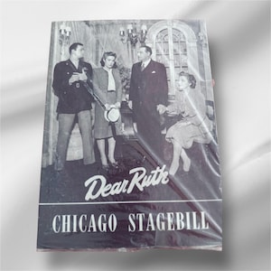 May include: Black and white photo of a playbill for the play "Dear Ruth" with a photo of the cast. The playbill is for the Chicago Stagebill.
