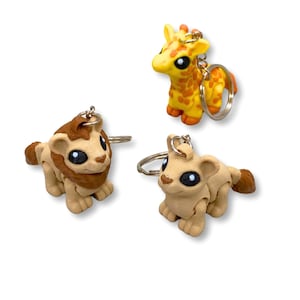 Bag Charms Sleutelhangerbundel, leeuw, leeuwin en giraf sleutelhangerbedel