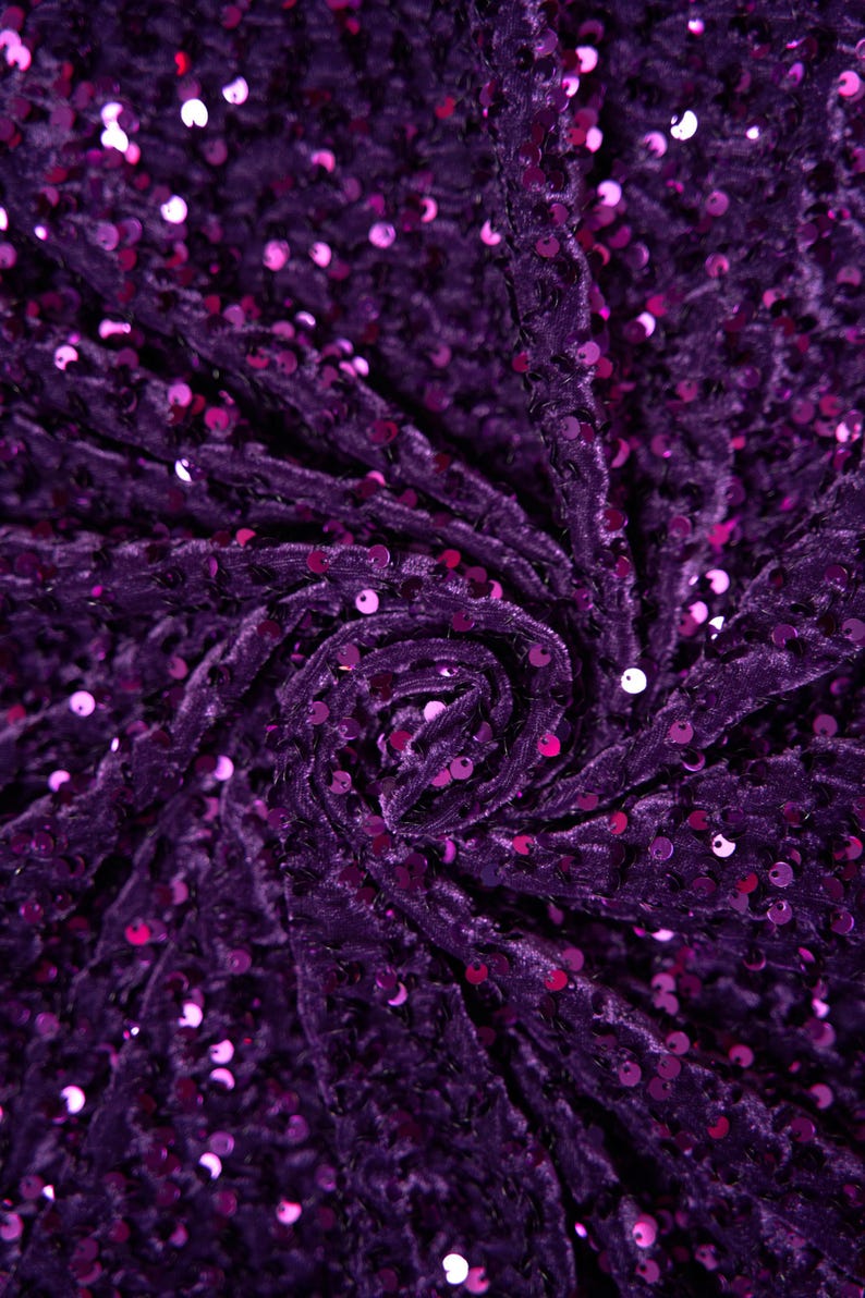 May include: Purple velvet fabric with a swirl pattern and small, iridescent sequins.