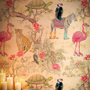 May include: Wallpaper featuring a repeating pattern of animals including a leopard, flamingos on roller skates, a zebra wearing boots, and turtles among trees and pink flowers. In the foreground, three white pillar candles and a small bowl.