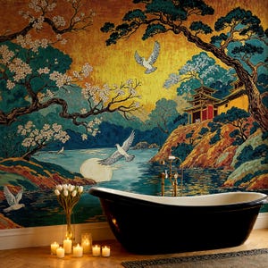 May include: A black, freestanding bathtub is positioned in front of a colourful mural of a Japanese landscape with a lake, pagodas, and doves. Candles and white flowers add to the serene scene.