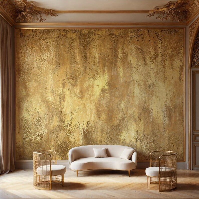Luxurious Art Deco lounge featuring a curved cream sofa and intricate wire chairs. Faux Gold Plaster Wallpaper covering expansive walls for a grand, opulent, and rustic glam interior design.