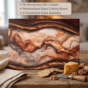 May include: A rectangular glass cutting board featuring a swirling abstract pattern in shades of copper, brown, and cream. The text "Olivia & Steven" and "7 Years" is printed on the surface. A text box above reads "7th Anniversary Gift | Copper", "Personalized Glass Cutting Board", and "2 Convenient Sizes Available".
