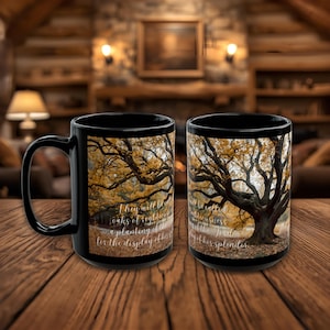 May include: Two black coffee mugs with a fall tree design. The tree has yellow and orange leaves. Text on the mug reads "They will be oaks of righteousness, a planting of the Lord for the display of his splendor."