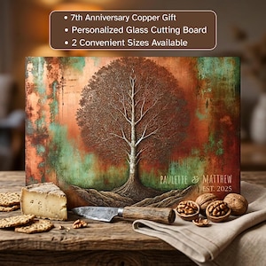 May include: A rectangular glass cutting board featuring a printed copper and teal patina tree design with the text PAULETTE & MATTHEW EST. 2025. The board is displayed with a wedge of cheese, a knife, and walnuts on a wooden surface.