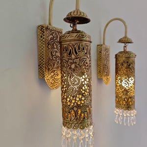 Handmade solid brass Moroccan wall sconce with crystal drops and carved lantern shade