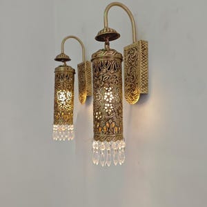 Decorative Moroccan brass wall light with shadow pattern effect