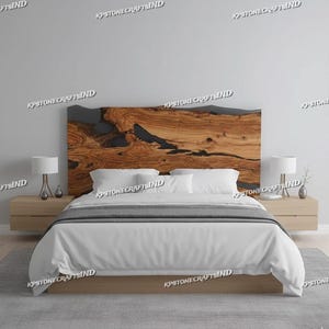 May include: A wooden headboard with a live edge design, featuring natural wood grain and dark epoxy resin accents. The bed is made with a light-colored wooden frame, white bedding, and two matching nightstands with lamps.