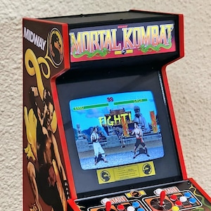 1/4 scale Mortal Kombat arcade cabinet. Fully functional miniature!