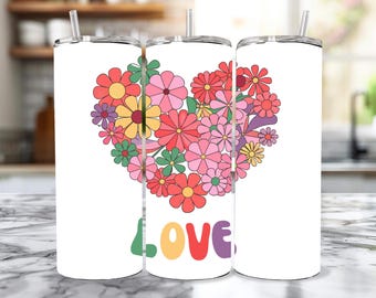 May include: Three white stainless steel tumblers with a floral heart design and the word "LOVE" in colorful letters. The flowers are pink, red, yellow, and purple.