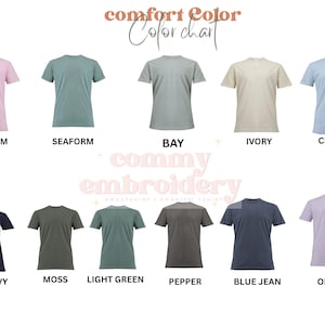May include: A color chart of Comfort Colors t-shirts in various hues, including Bloosom, Seafoam, Bay, Ivory, Chambary, True Navy, Moss, Light Green, Pepper, Blue Jean, and Orchid. The text "comfort Color Color chart" and "commy embroidery" are also visible.