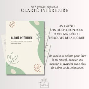 May include: A notebook with the text "CLARTÉ INTÉRIEURE" in a minimalist design. The cover is light beige with green and brown abstract shapes and leaf illustrations. The notebook is designed to help organize ideas and find clarity.