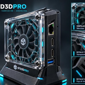 Pode incluir: Um dispositivo de refrigeração preto STD3DPRO com tampa de acrílico transparente, ventoinha central com grelha hexagonal e detalhes em LED azul. A unidade inclui uma porta Ethernet, duas portas HDMI e uma porta USB.