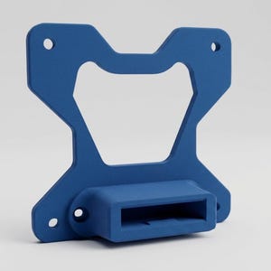May include: A blue, geometric bracket with a rectangular base and a central cutout. The bracket has several circular holes and a textured surface. The design is symmetrical and appears to be made of a solid material.