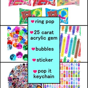 May include: An assortment of colorful Ring Pop candies in various flavors, alongside a collection of 25-carat acrylic gems, bubbles, stickers, and pop-it keychains. The image features a variety of vibrant colors and designs.