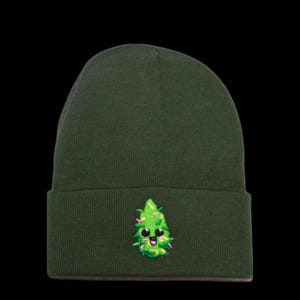 May include: A dark green beanie with a green cartoon marijuana leaf with a smiling face embroidered on the front.